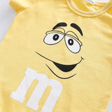 m&m's Chocolate Candy inspired Baby Bodysuit yellow cotton close up