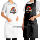 woman-wearing-jurassic-pork-grill-dinosaur-park-meat-bbq-smoking-apron-mens-unisex-black-and-white-available-from-novelty-food-gifts-dot-com
